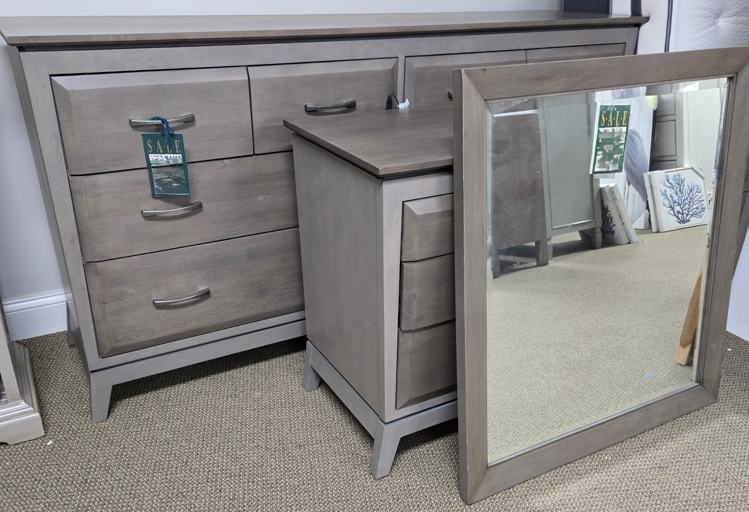 a dresser with a mirror on top of it