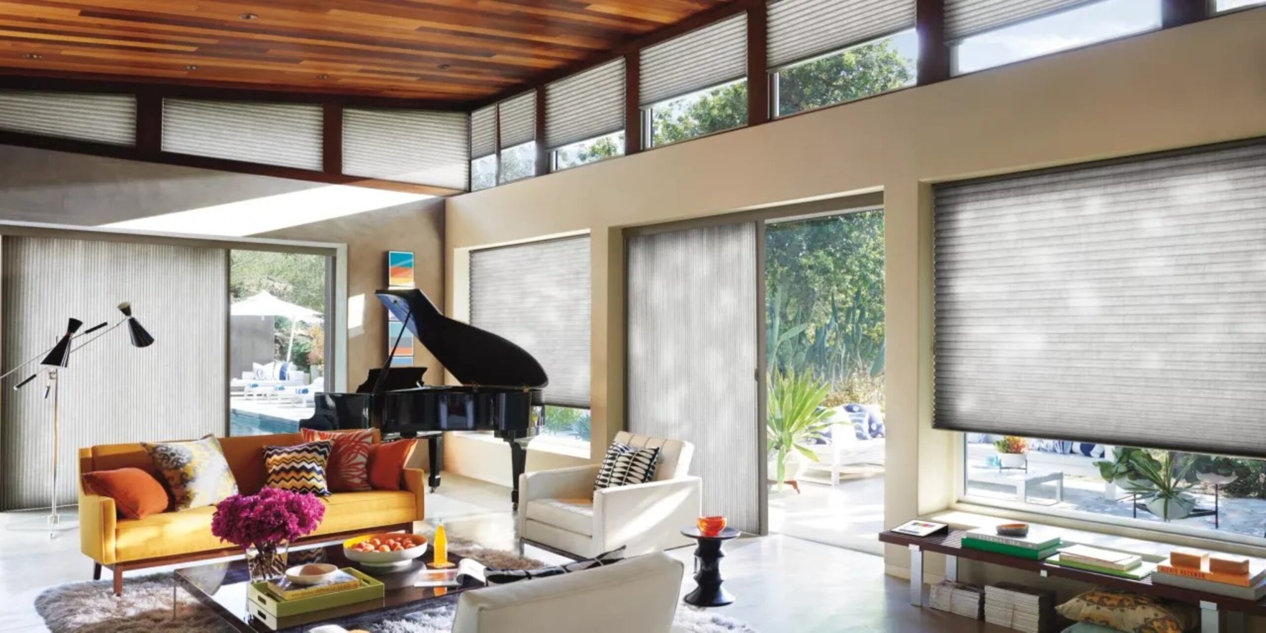 a living room filled with furniture and a piano