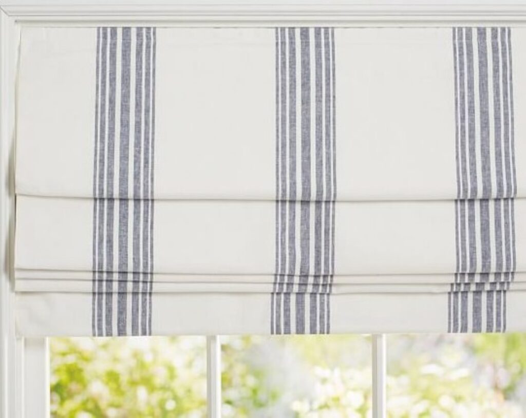 Thumbnail of http://a%20window%20with%20a%20blue%20and%20white%20striped%20roman%20blind