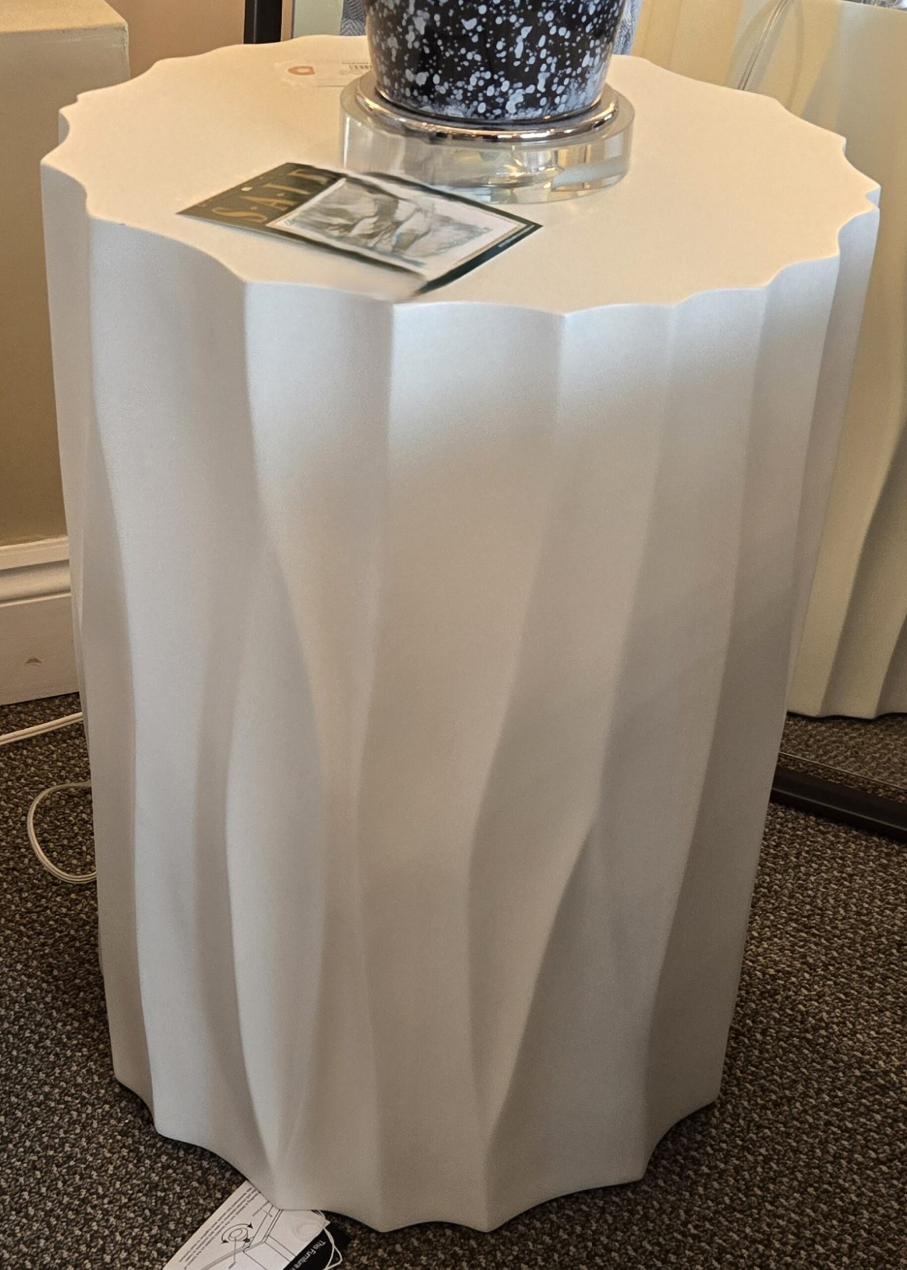 a table with a vase on top of it