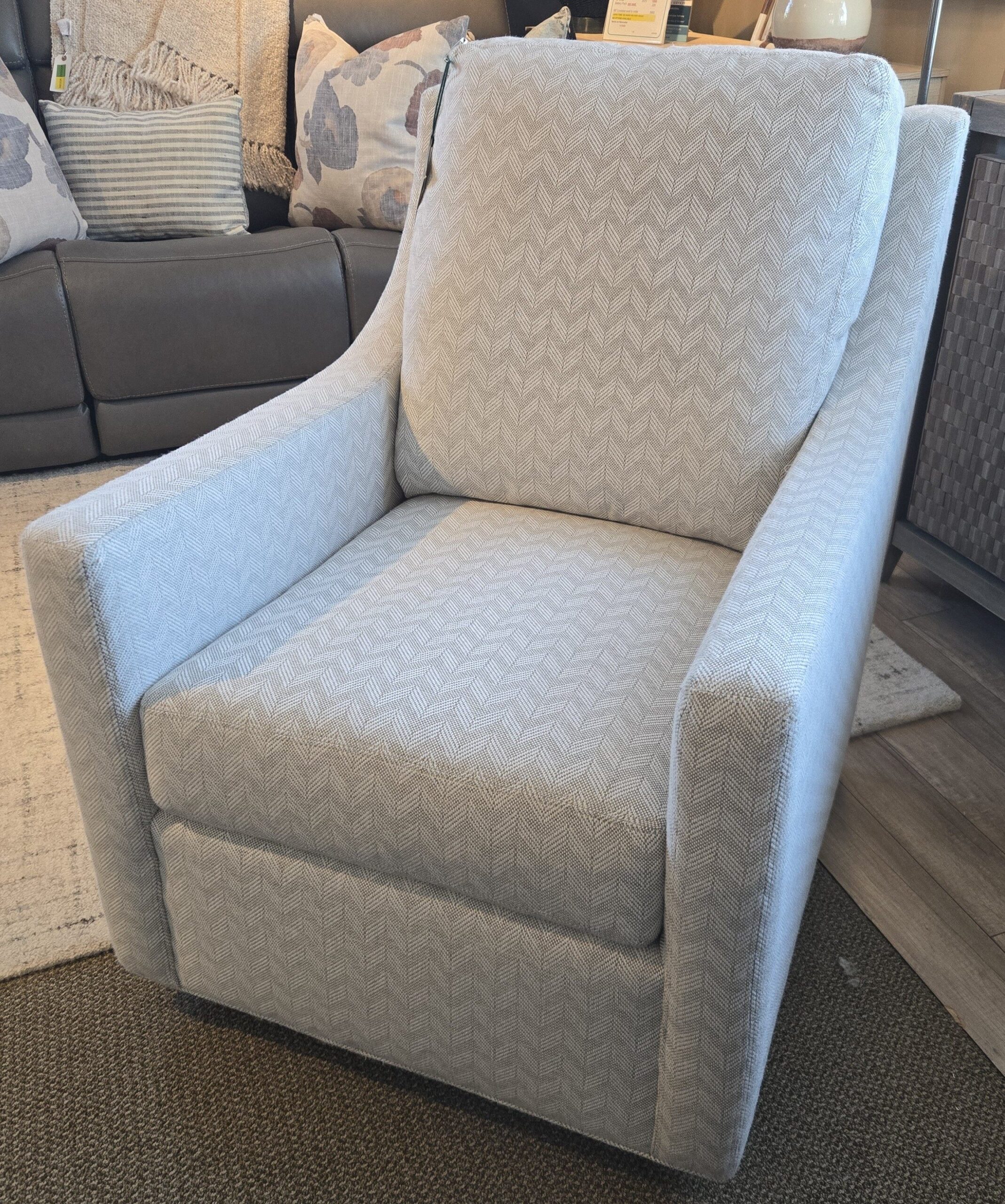 a living room filled with furniture and pillows
