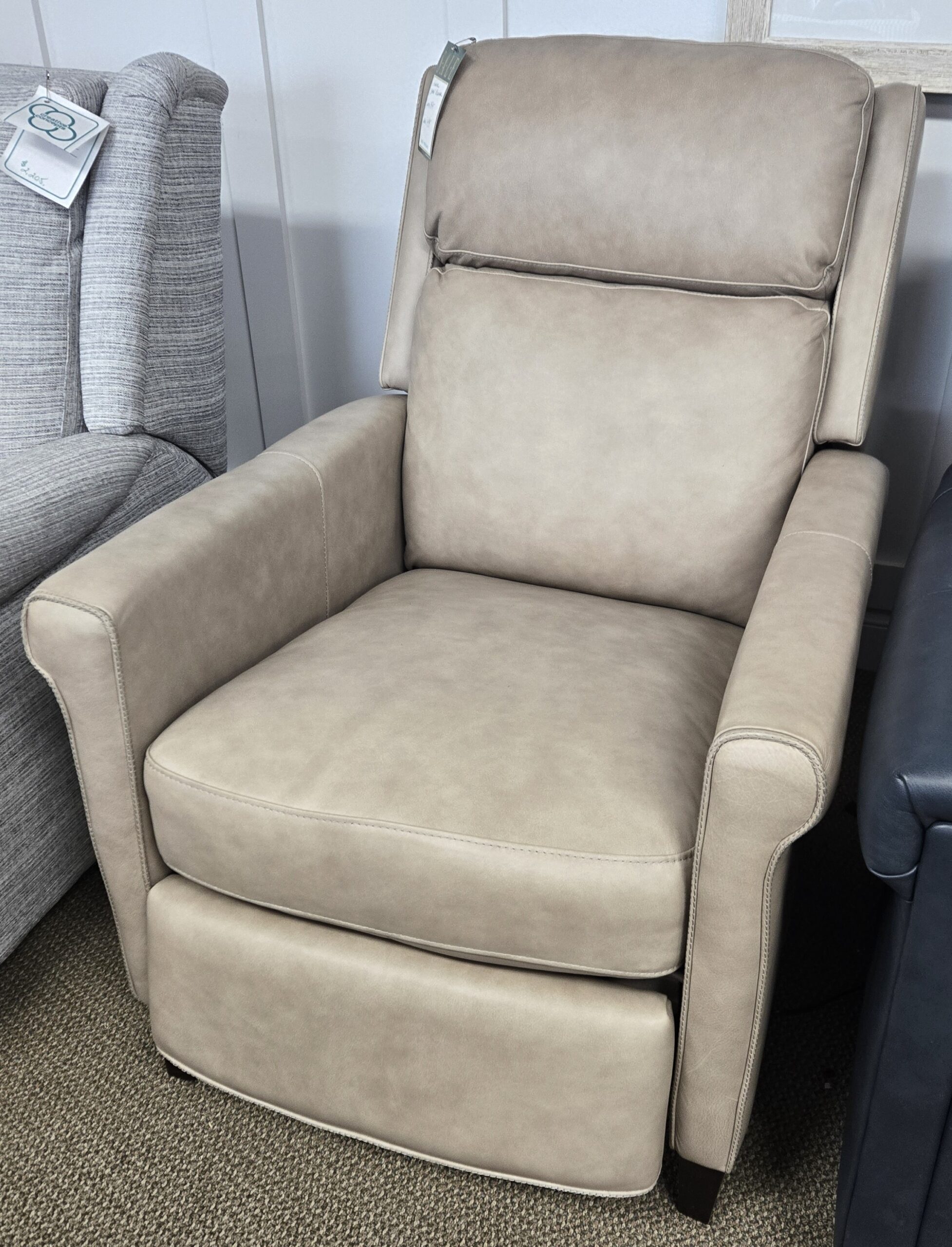 a chair and a recliner in a room