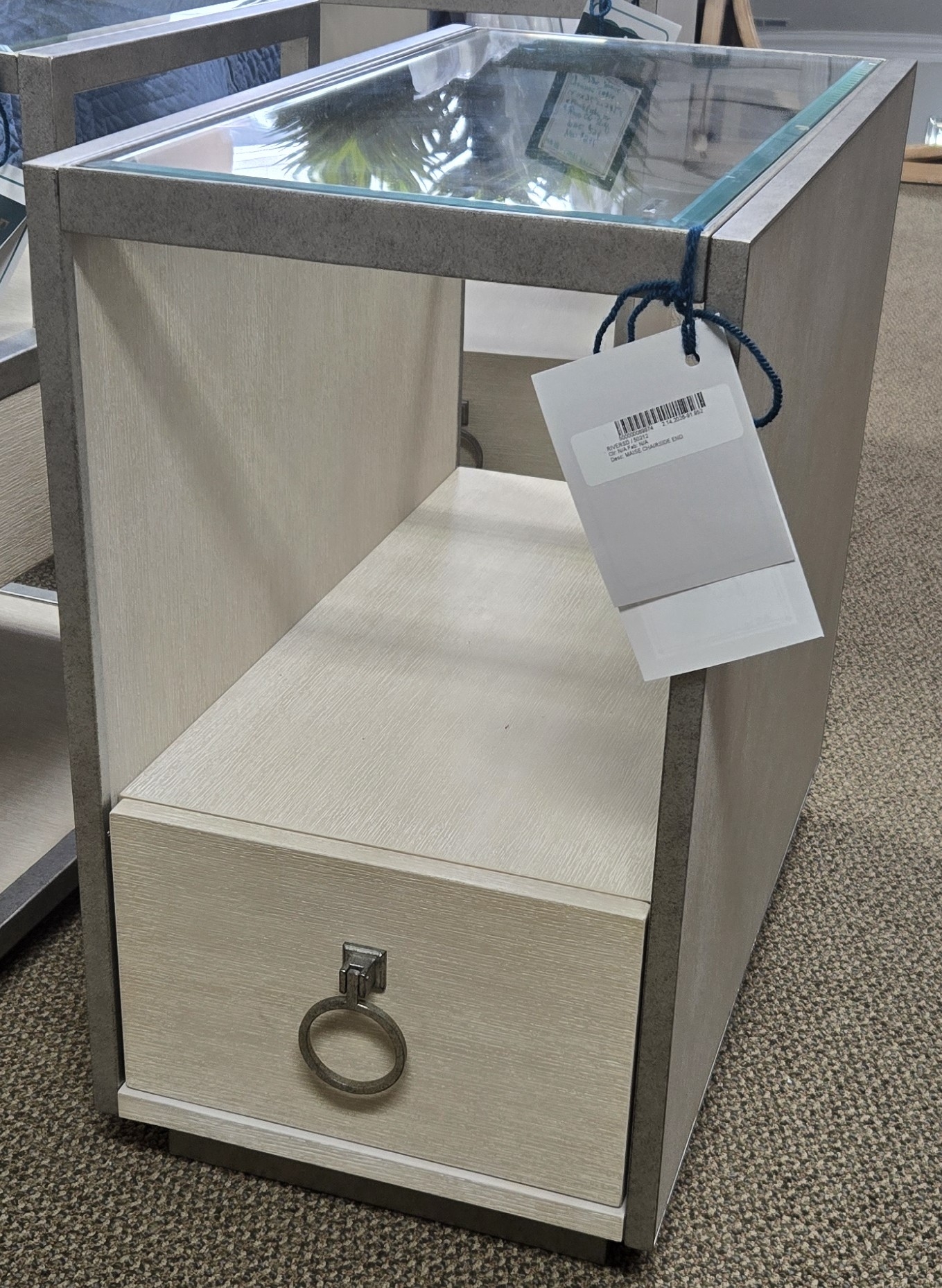 a glass display case with a ring on it