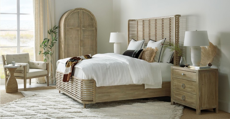 a bedroom with a bed, dresser, and chair