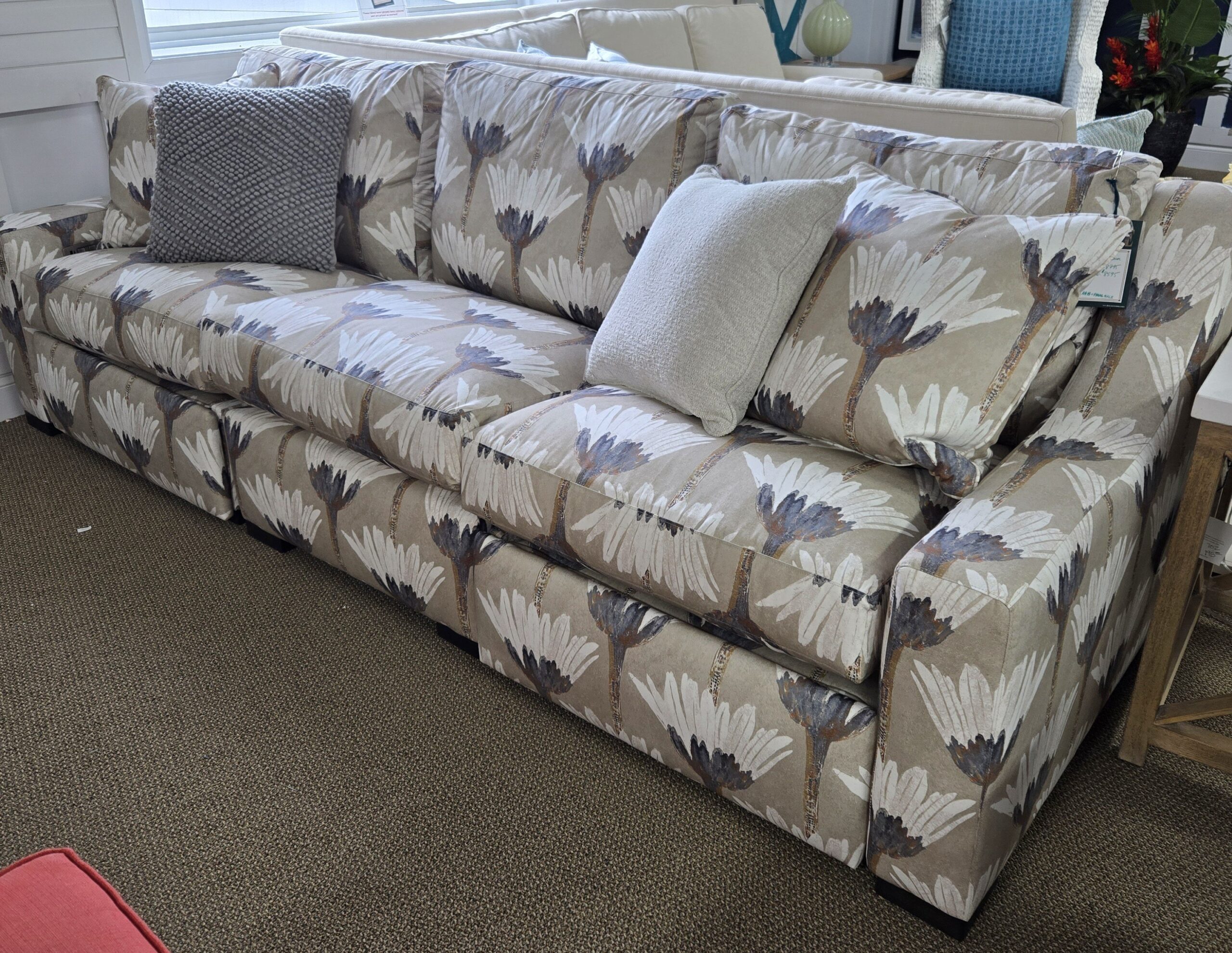 a living room filled with furniture and a window