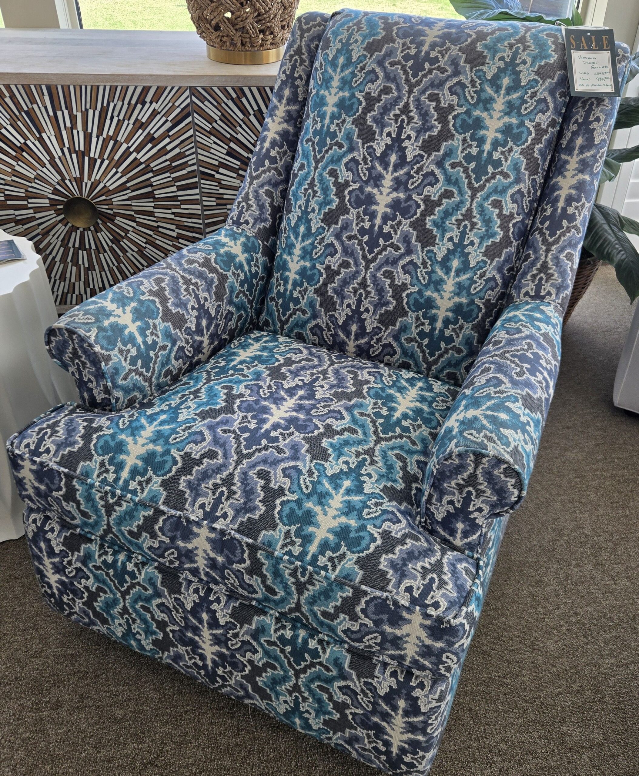 a blue and white chair in a room