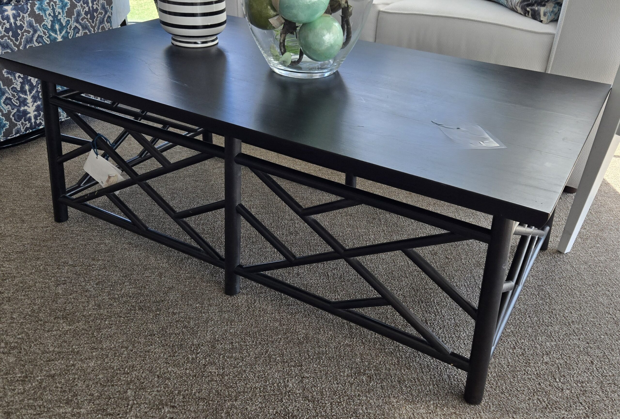 a table with a vase of flowers on top of it