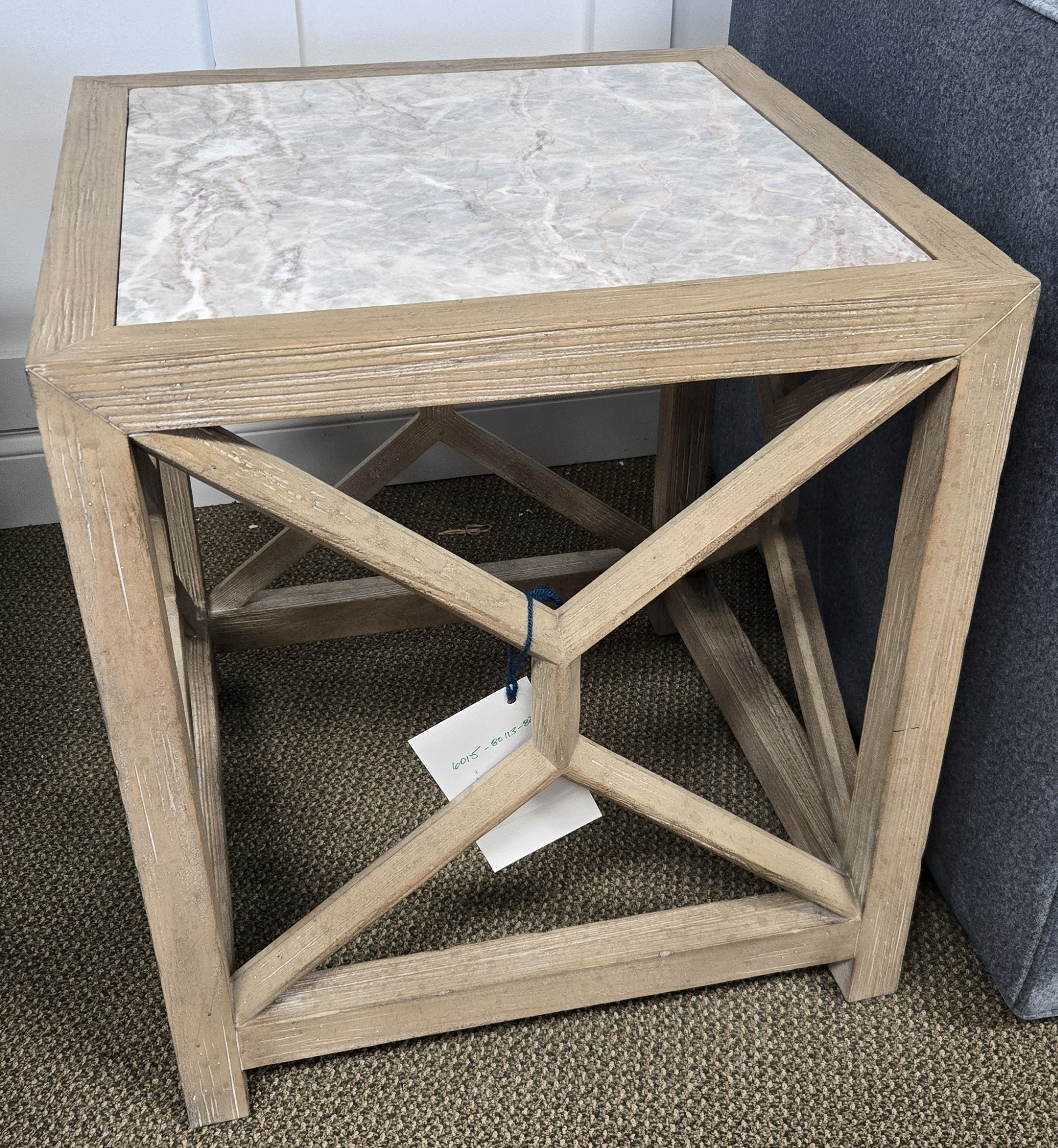 a small table with a white marble top