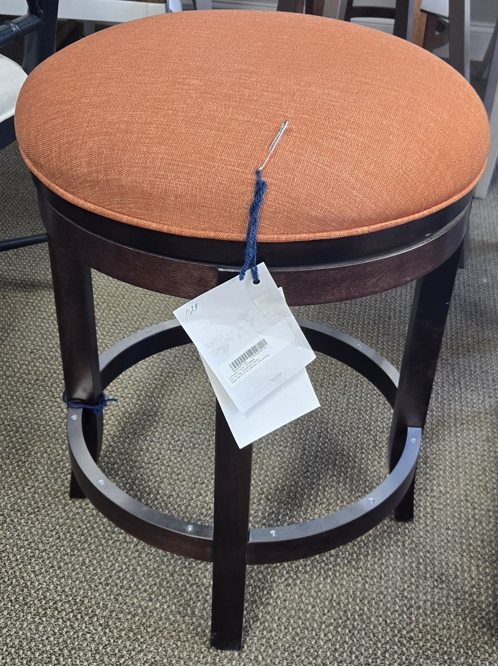 a chair with a tag on it in a room
