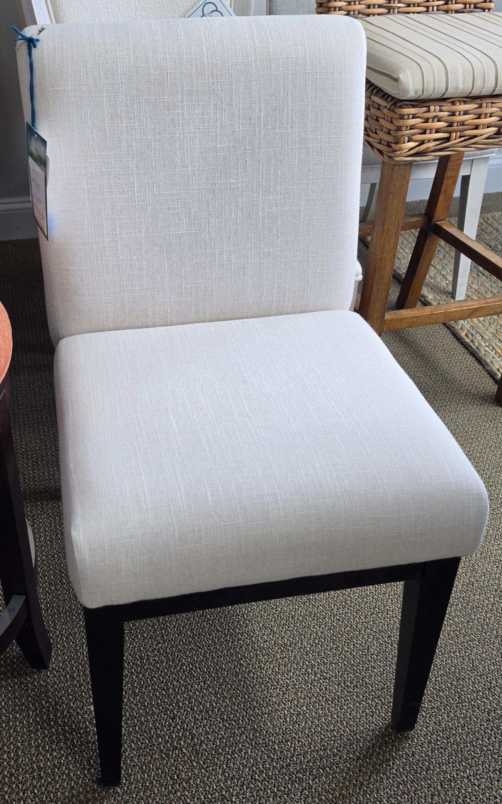 a white chair sitting in a room next to a table