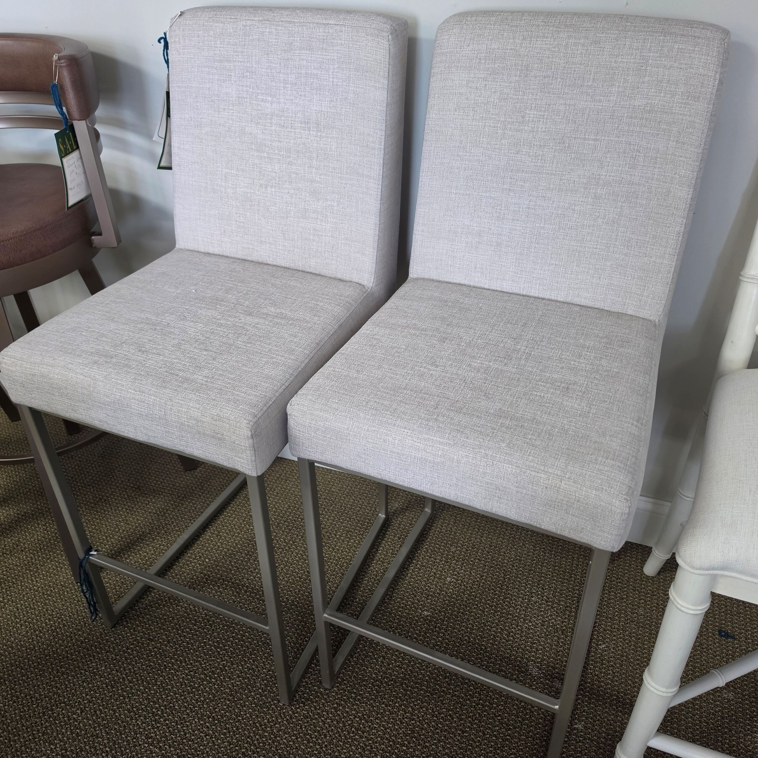 a couple of chairs that are next to each other