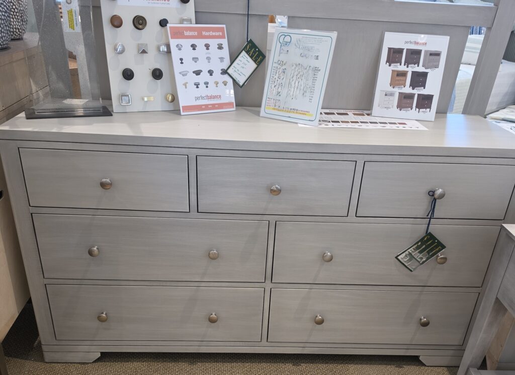Thumbnail of http://a%20dresser%20with%20drawers%20and%20pictures%20on%20it