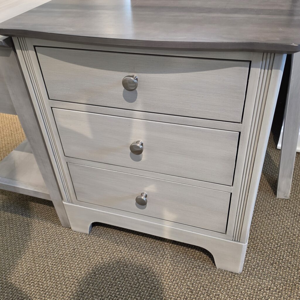 Thumbnail of http://a%20grey%20dresser%20with%20a%20mirror%20on%20top%20of%20it