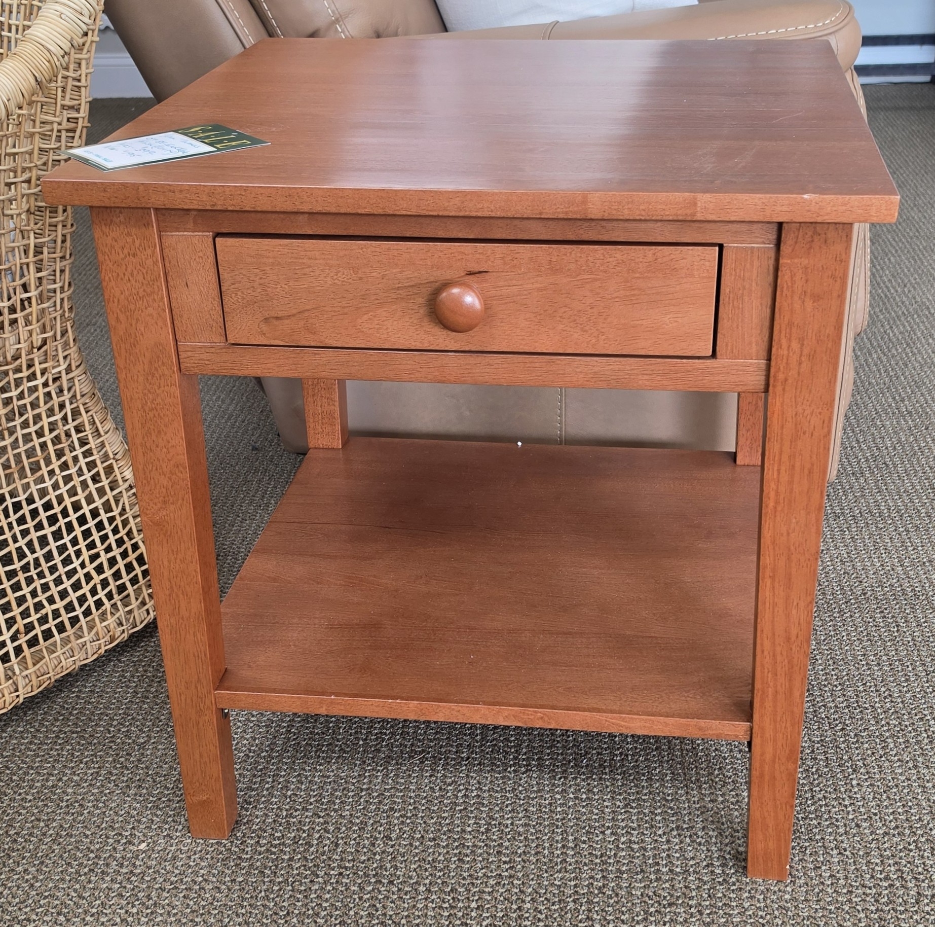 a wooden table with a drawer on top of it