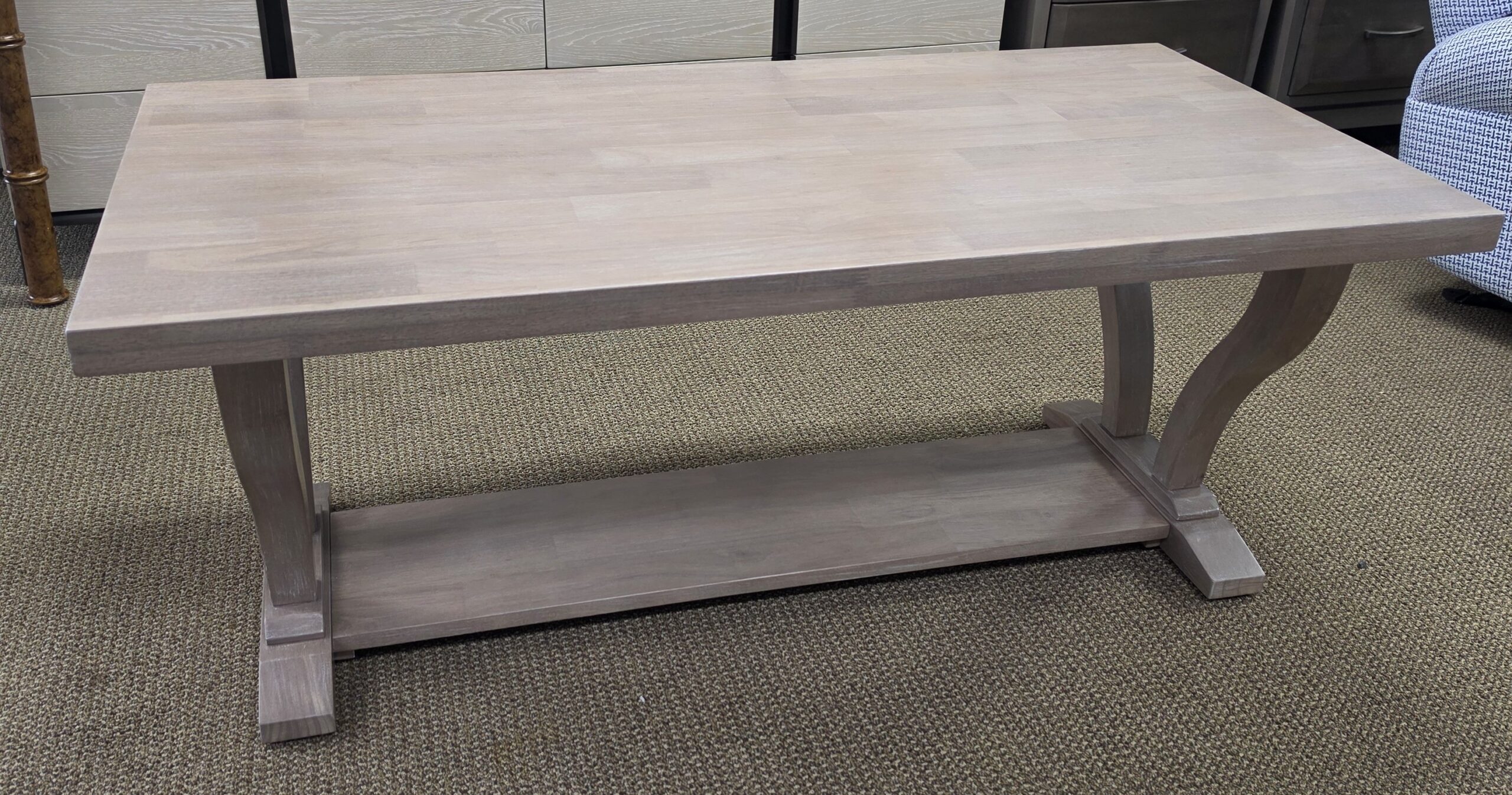 a table in a room with a chair in the background