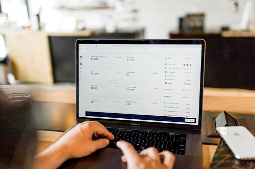 Person views advertising data on laptop