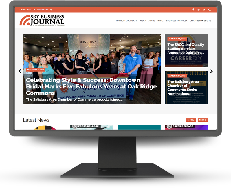 Monitor displaying home page of SBY Business Journal
