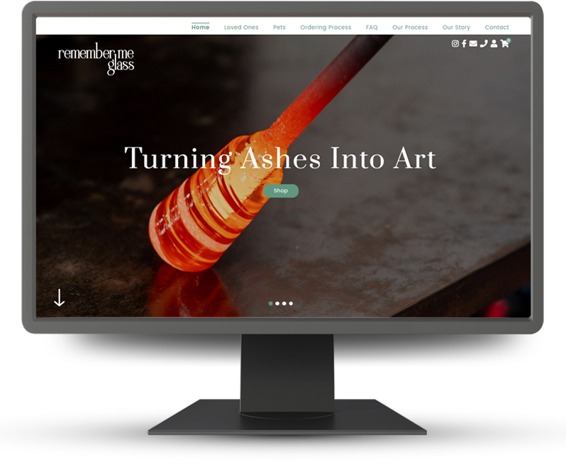 Monitor displaying home page of Remember Me Glass