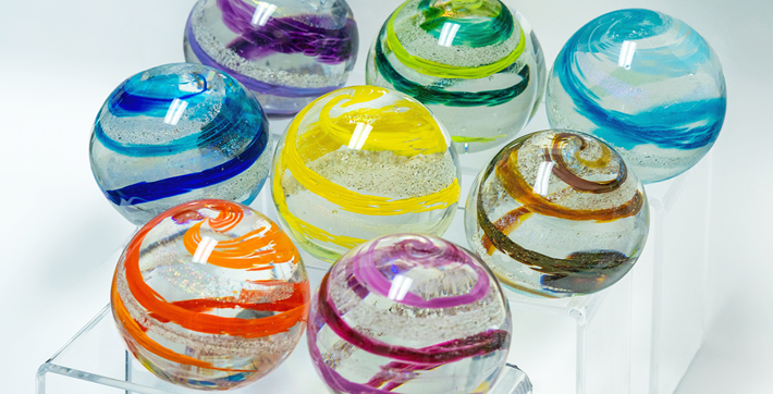 Assorted colors of glass spheres made by Remember Me Glass