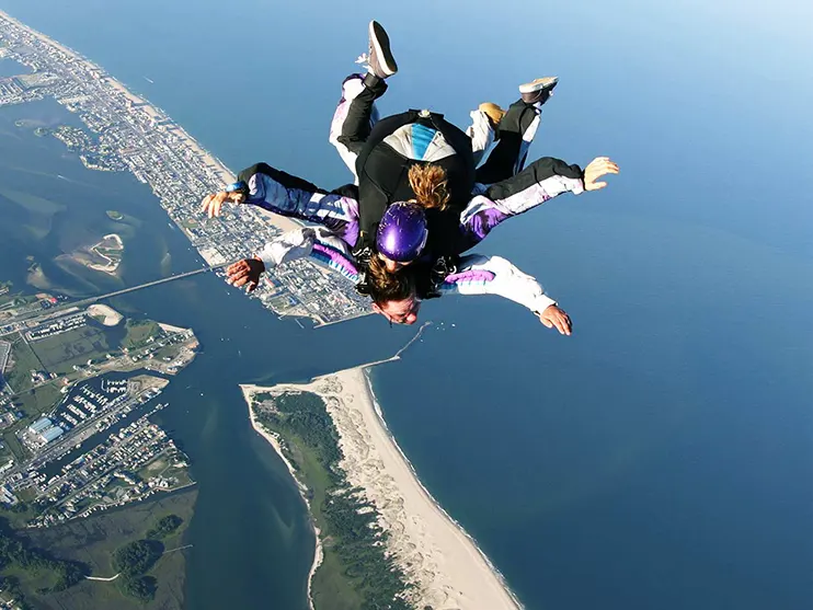 Two people skydiving above Ocean City and Assateague Island