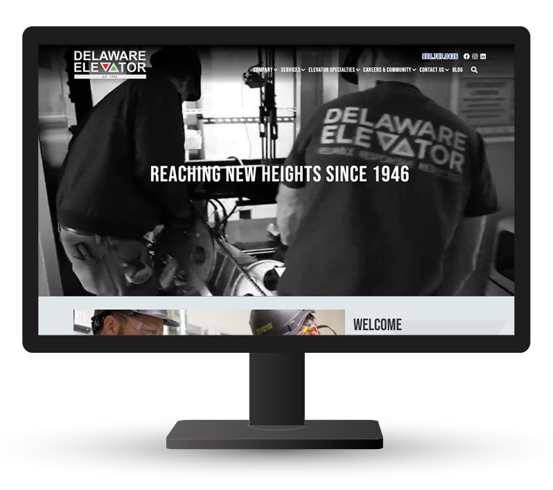 Monitor displaying website for DE Elevator