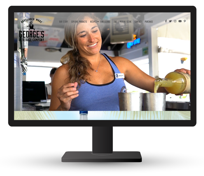 Monitor displaying website for George's Beverage Company