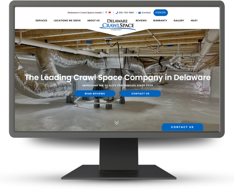 Monitor displaying home page of DE Crawlspace Co.