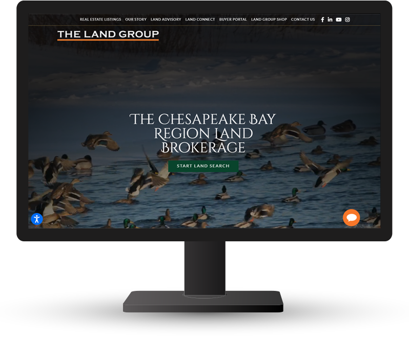 Monitor displaying the home page for The Land Group