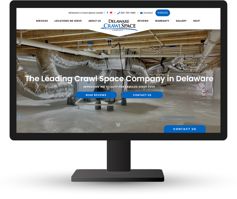 Monitor displaying DE Crawlspace website