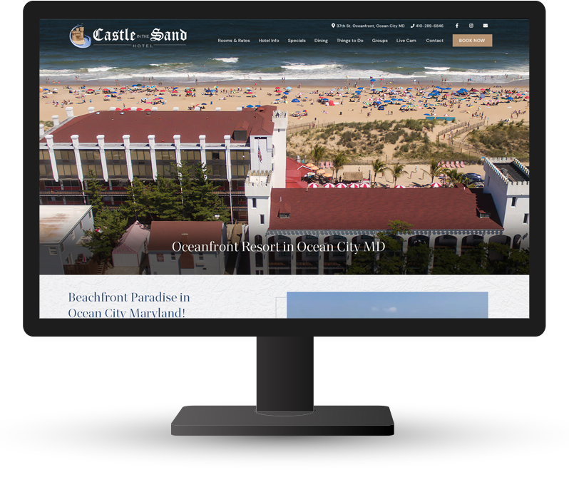 Monitor displaying website for castle in the sand