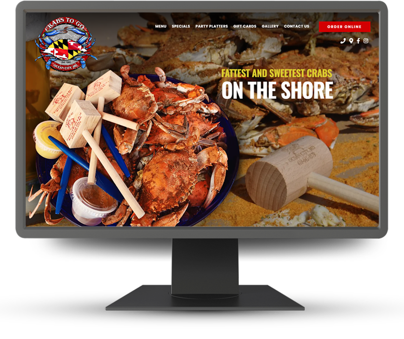 Monitor displaying home page of Crabs to Go
