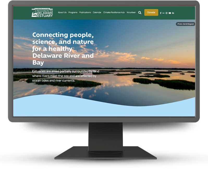 Monitor displaying home page of Partnership for the Delaware Estuary