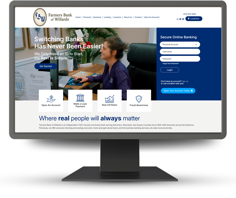 Monitor displaying home page of Farmers Bank of Willards