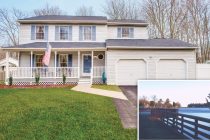 exterior of home with large front yard, front porch and two car garage