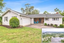 Rancher style home with garage and driveway