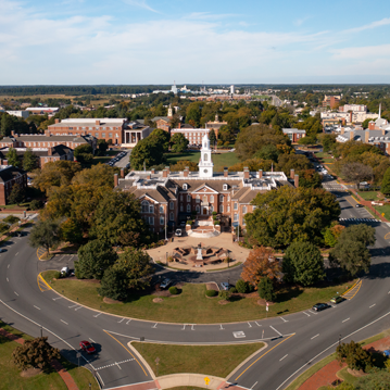 an aerial view of a city with a clock tower