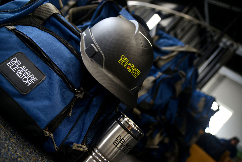 a helmet sits on top of a blue backpack