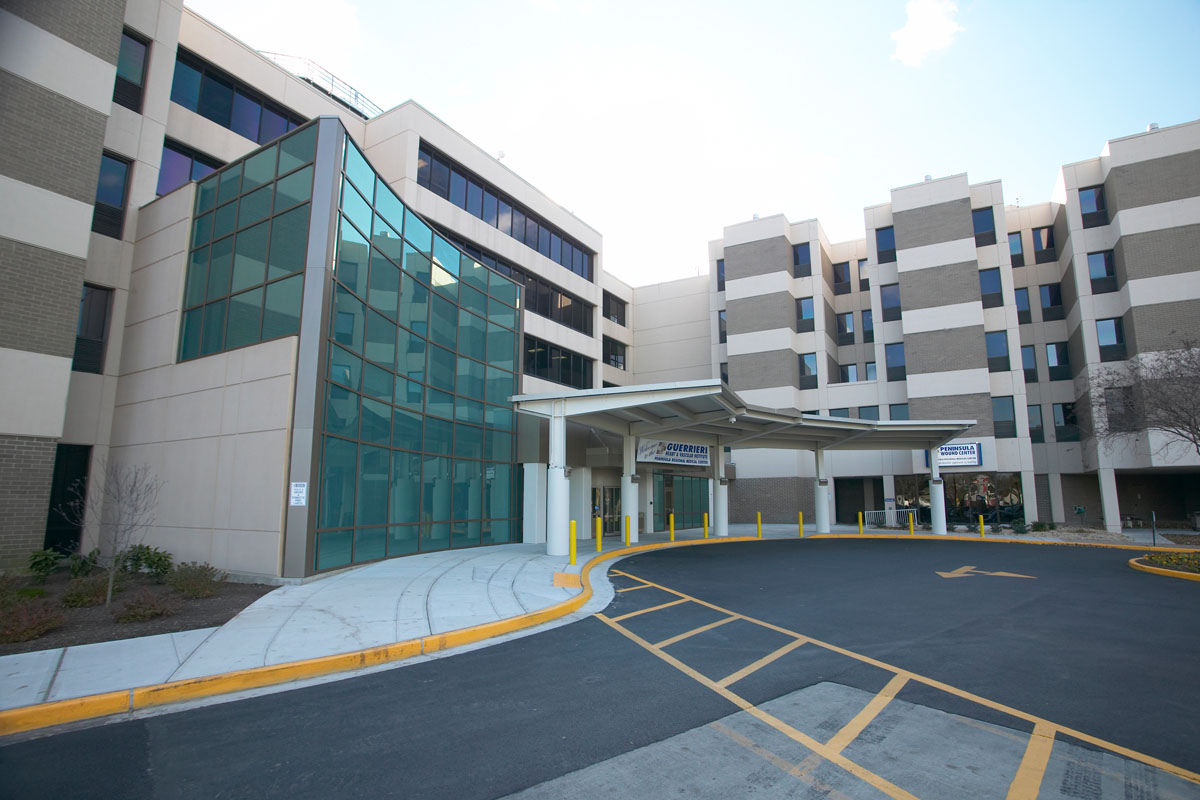 a large building with a parking lot in front of it