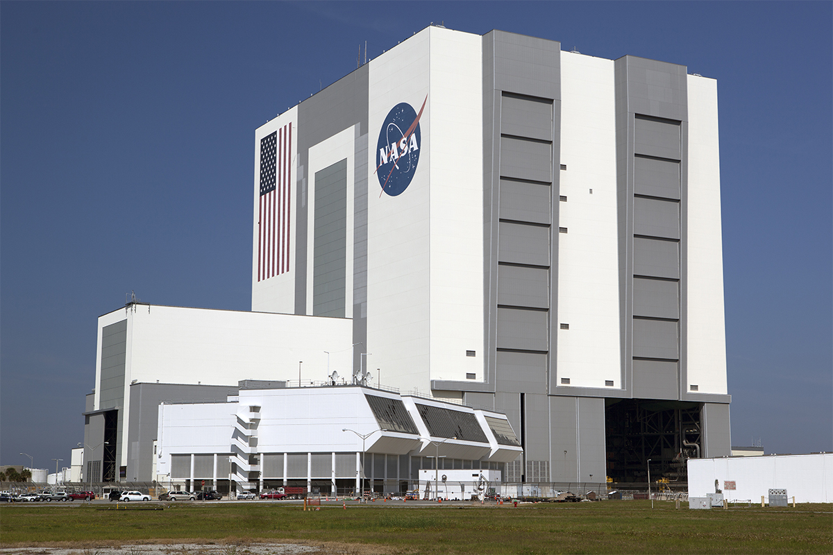a large building with a space shuttle on top of it