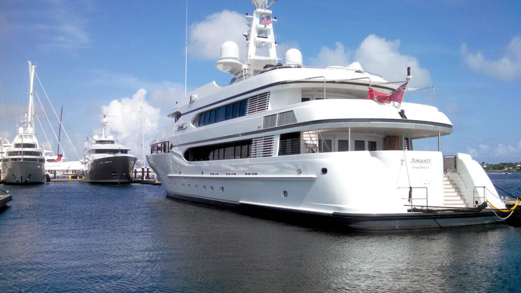 a large white boat docked at a dock
