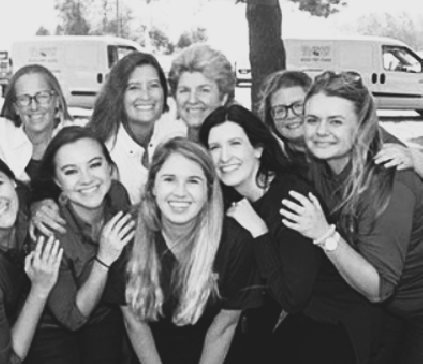 a group of women standing next to each other