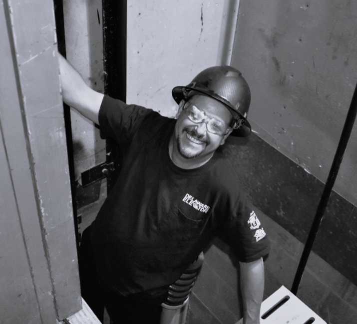 a man in a helmet is standing in a doorway
