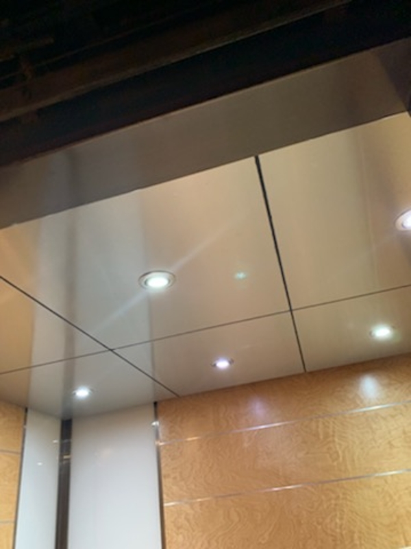 a room with a glass door and some lights