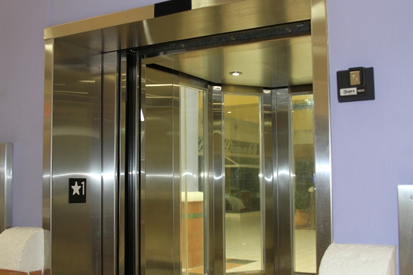 a large stainless steel elevator in a building