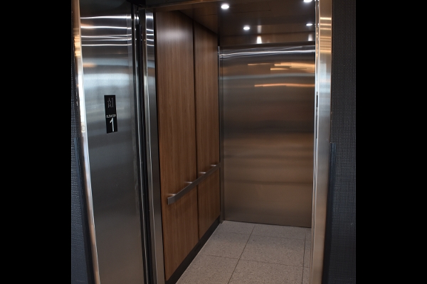 a stainless steel elevator in a building