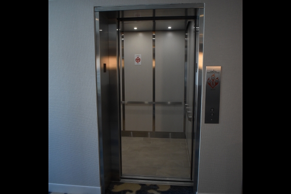 a stainless steel elevator in a building