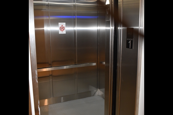a stainless steel elevator in a building