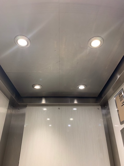 a bathroom with a toilet and a shower stall