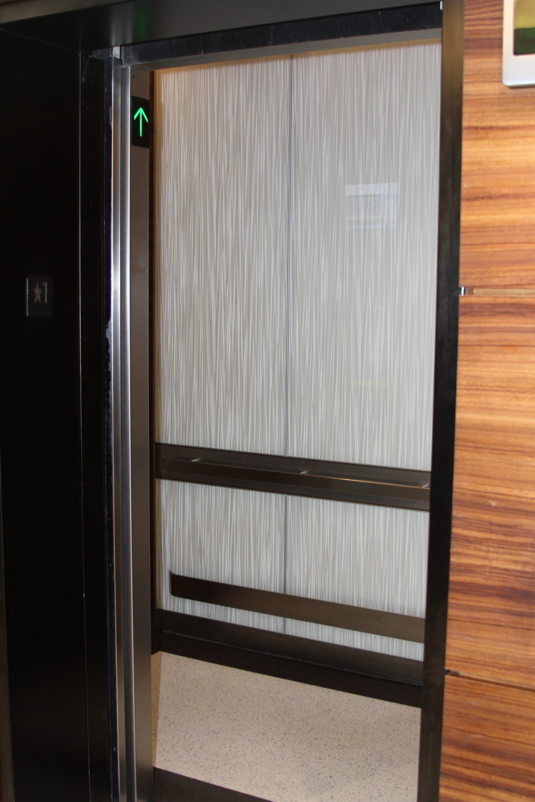 an elevator with a sliding door in a room