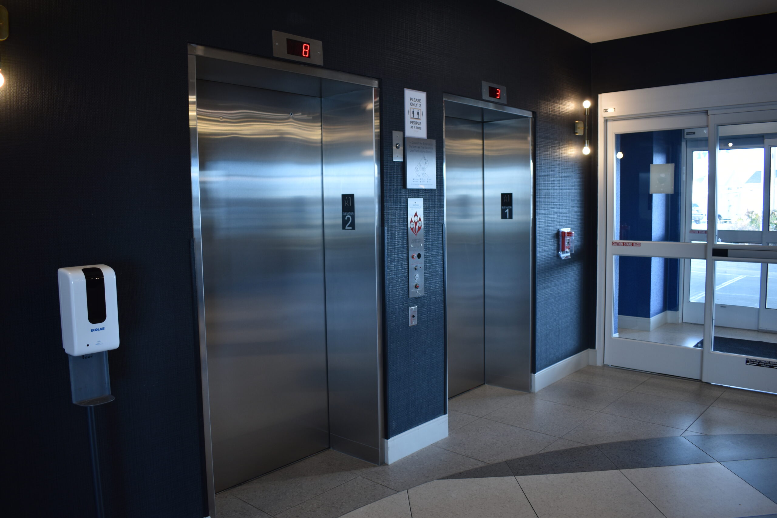 a room with a bunch of elevators in it